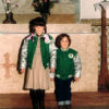 Patricia and Rodrigo stand side by side inside a church