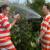 Lucas Foglia, Vanessa and Lauren watering, GreenHouse Program, 2014.