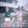 Two girls holding a fish
