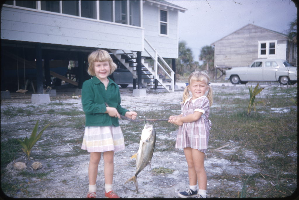 Two girls holding a fish