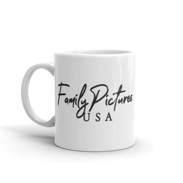 Side view of a small coffee mug with the Family Pictures USA logo, in black text.