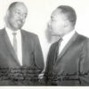 pictured are Rev Doggett listening intently as a very young Martin Luther King Junior stands profile next to him speaking
