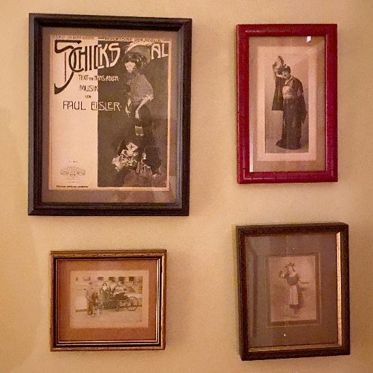 (l to r) A framed photo advertising Paul Eisler's music followed by three black and white photos of family members posed in various locations